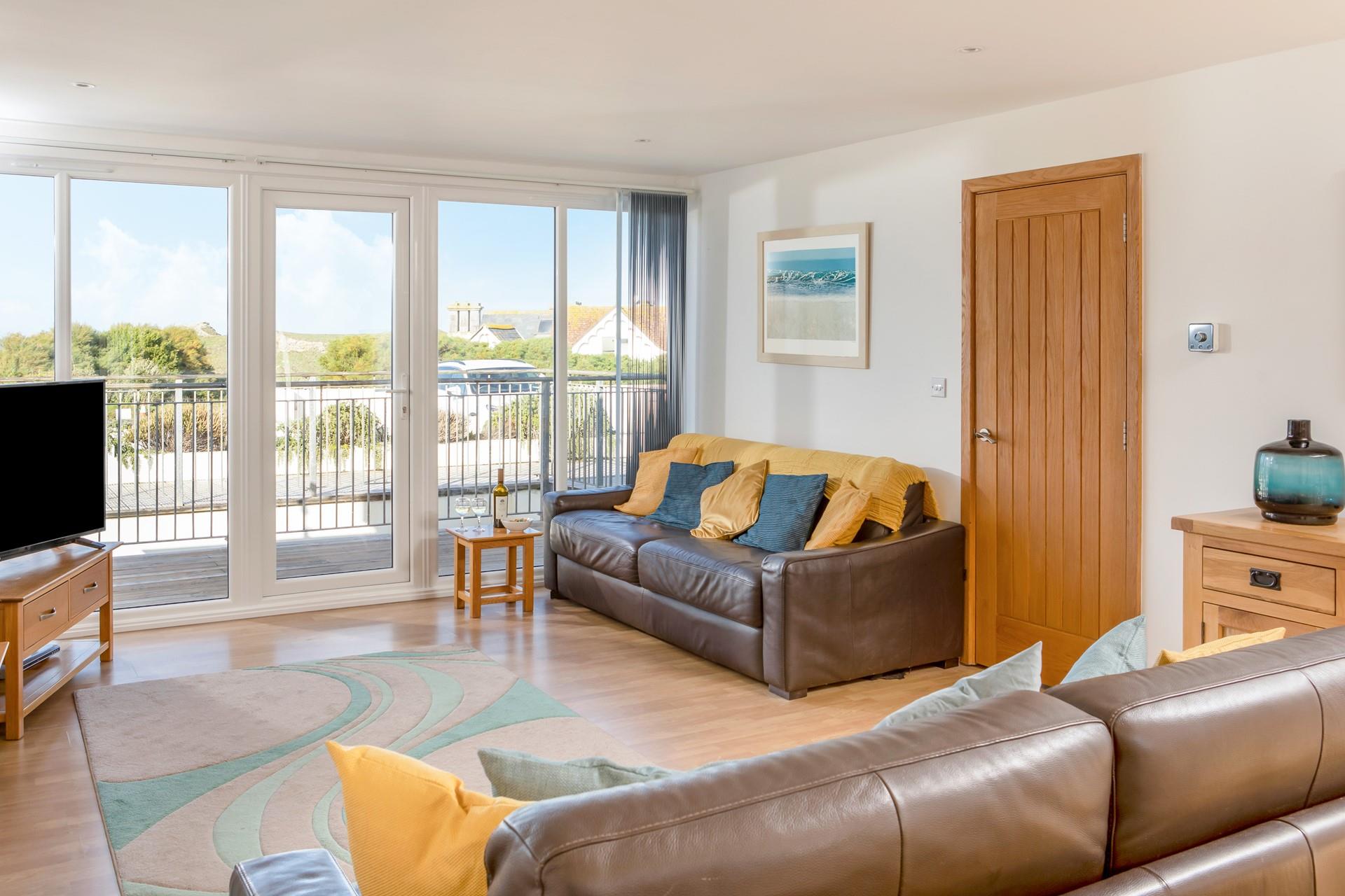 From the living space, the entrance hall leads to stairs down to all the bedrooms on the ground floor. 