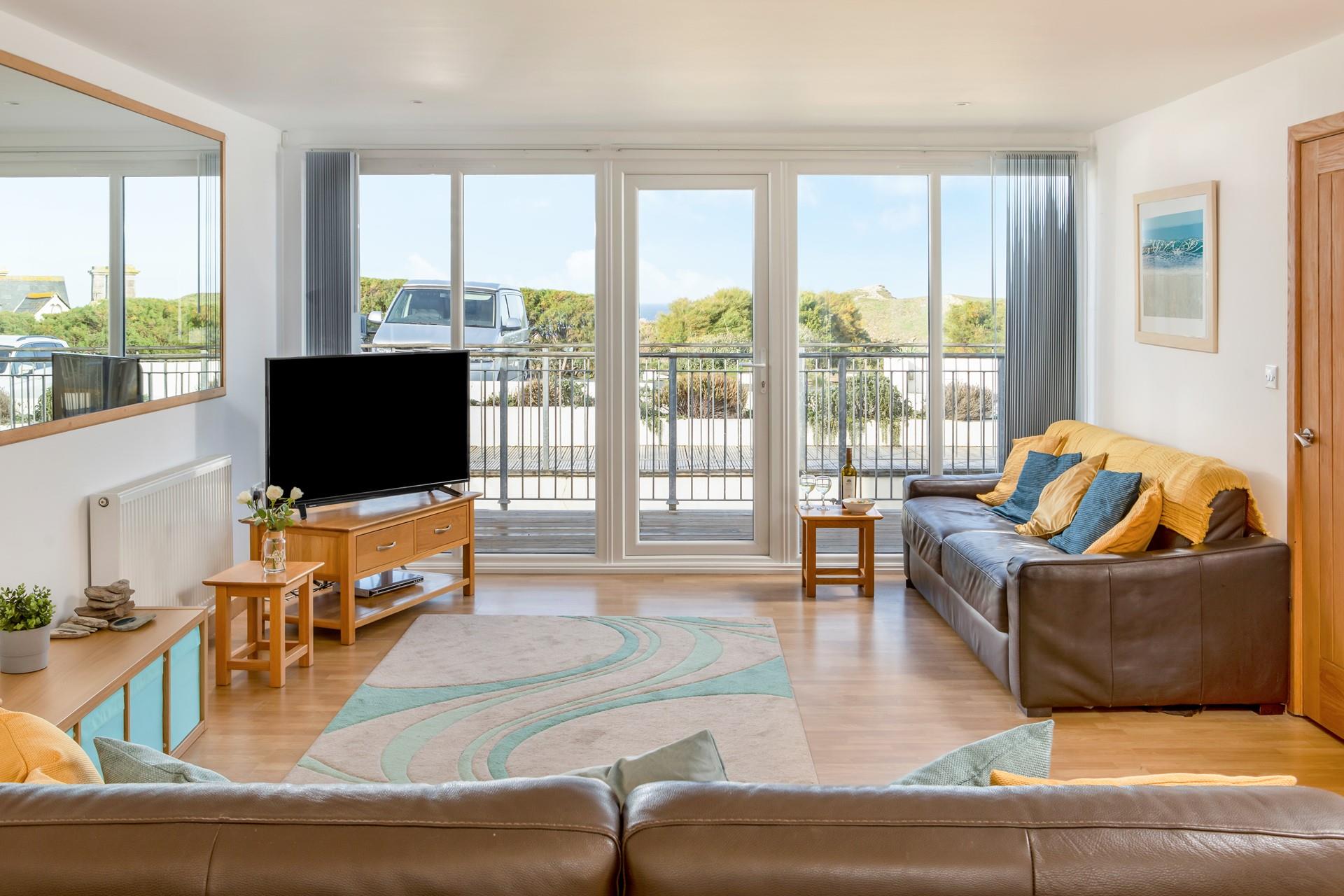 The spacious open plan living space is on the first floor, level with the parking area.