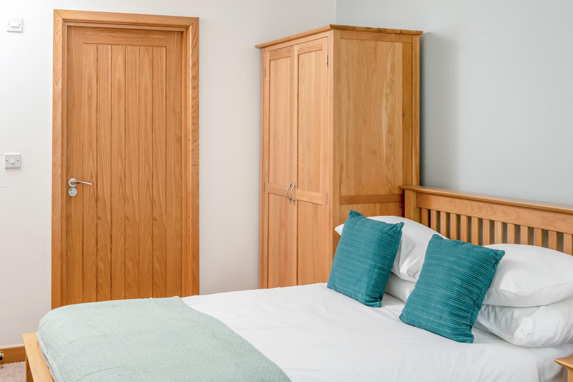 Bedroom 2 has a door out to the lower patio and benefits from another en suite shower. 