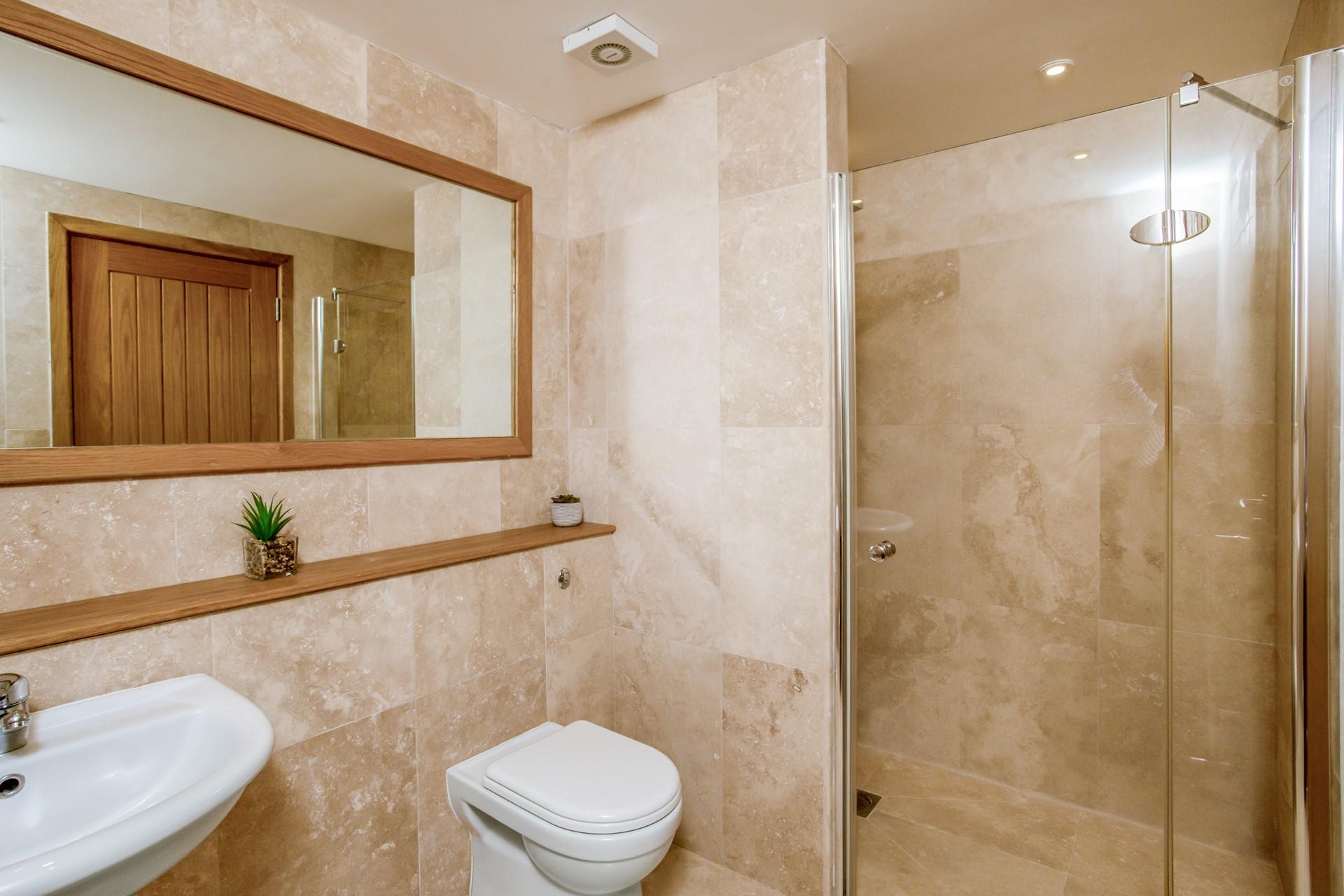 The en suite is the perfect space to get ready for the day.