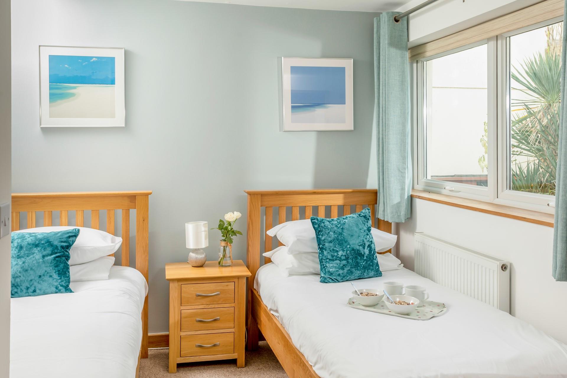 Nautical blues throughout make for a calm atmosphere, to ensure a good night's sleep for all.