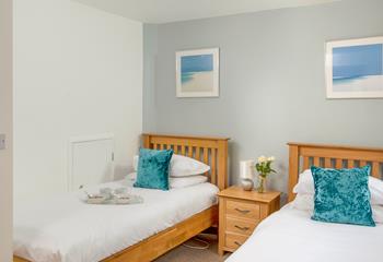 Bedroom 3 is a comfortable twin room and boasts a third en suite shower.