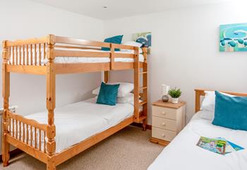 Bedroom 4 is an ideal kid's room, with bunk beds and a single bed creating the perfect sleepover space.