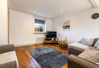 The sitting room is a cosy space to relax after spending the day on Sennen Cove.