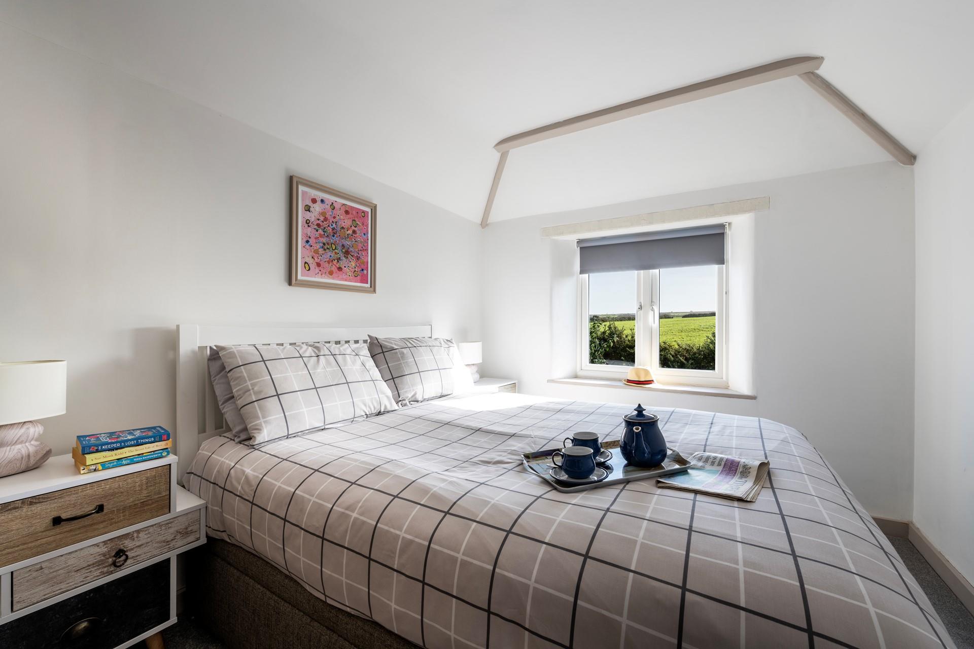 Wake up to countryside views from the comfortable king size bed.