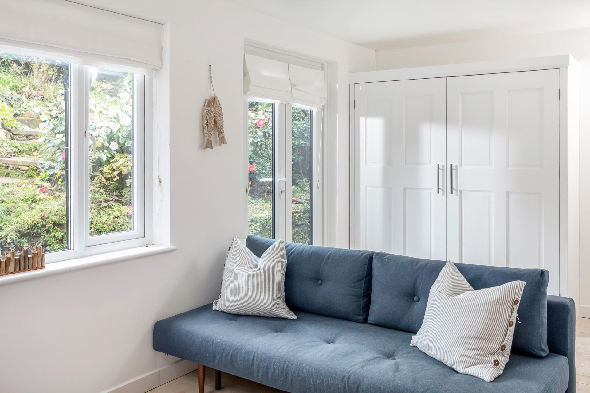 Open the patio doors that lead out to the back garden and let the fresh summer breeze in.