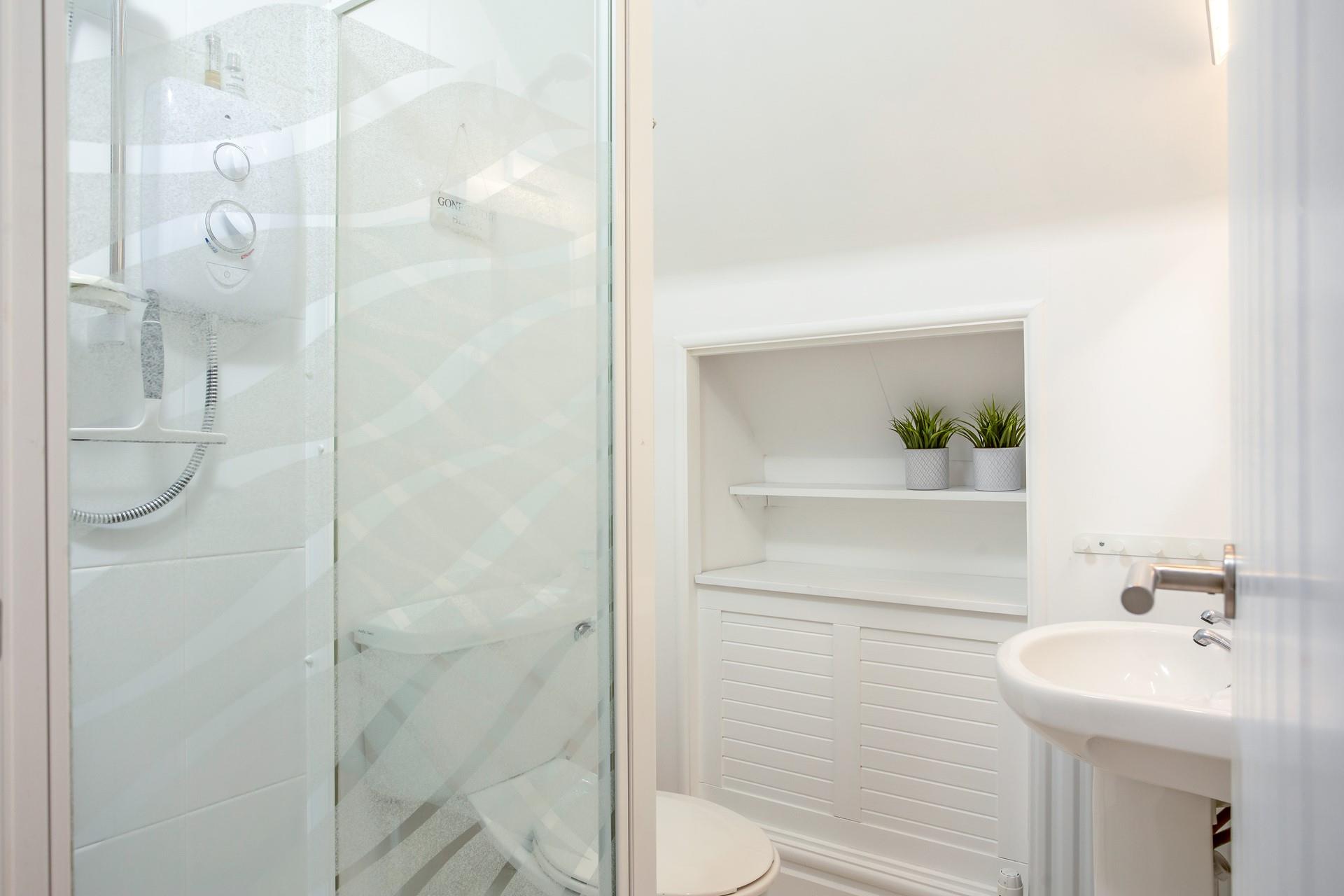 Wash off sandy toes in the shower after a day on Portmellon beach.