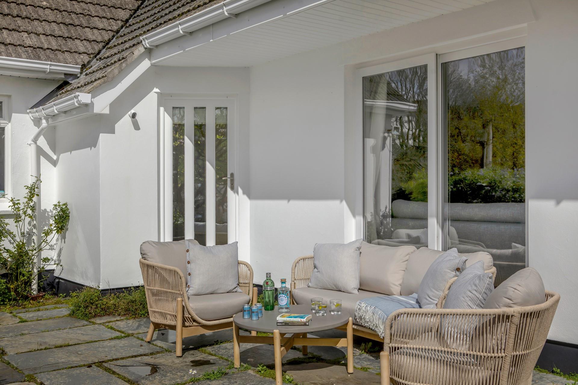 Enjoy a cold G&T in the afternoon sunshine after a day of exploring.