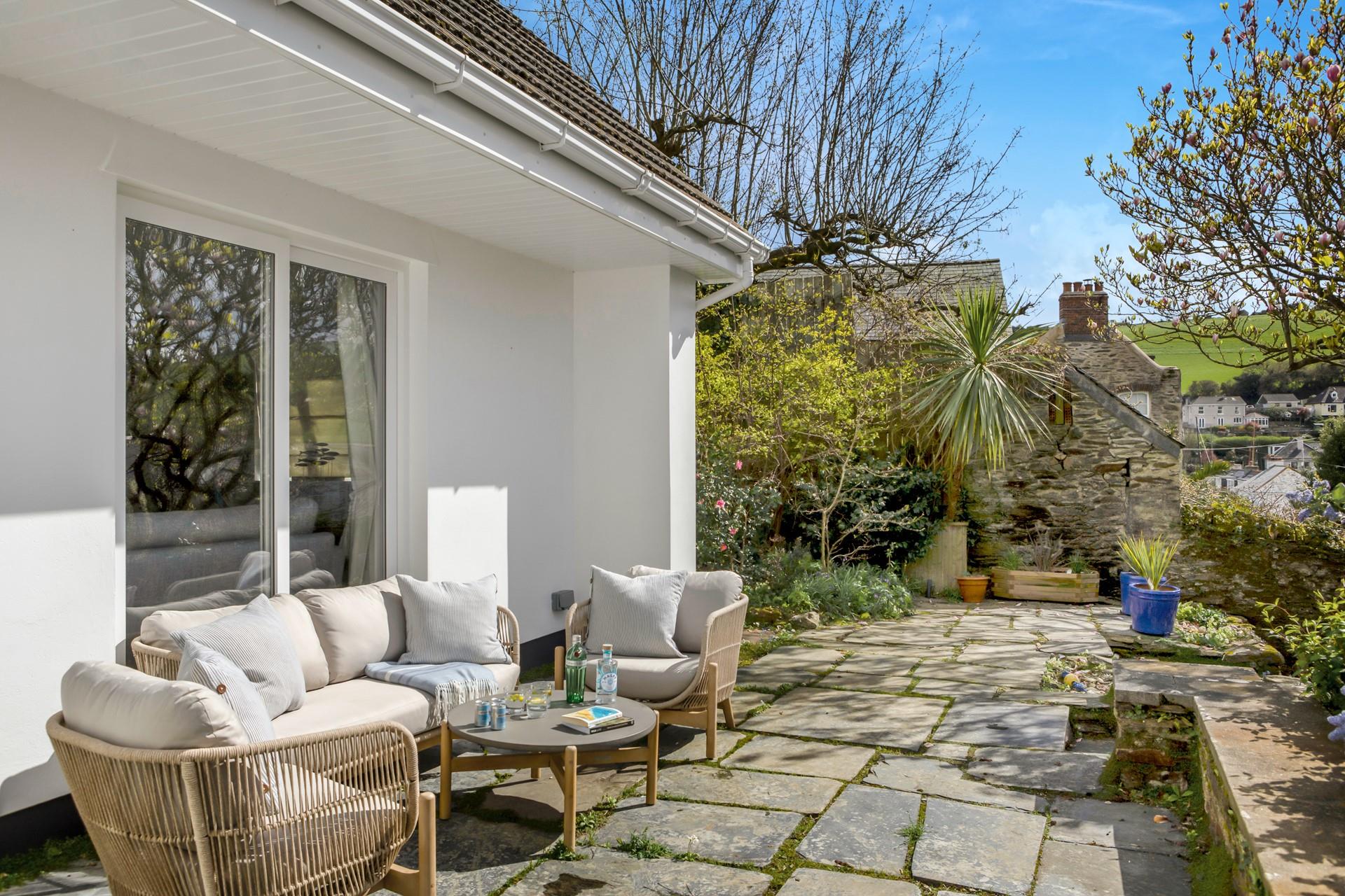 Relax on the stylish outdoor furnishings in the summer sunshine.