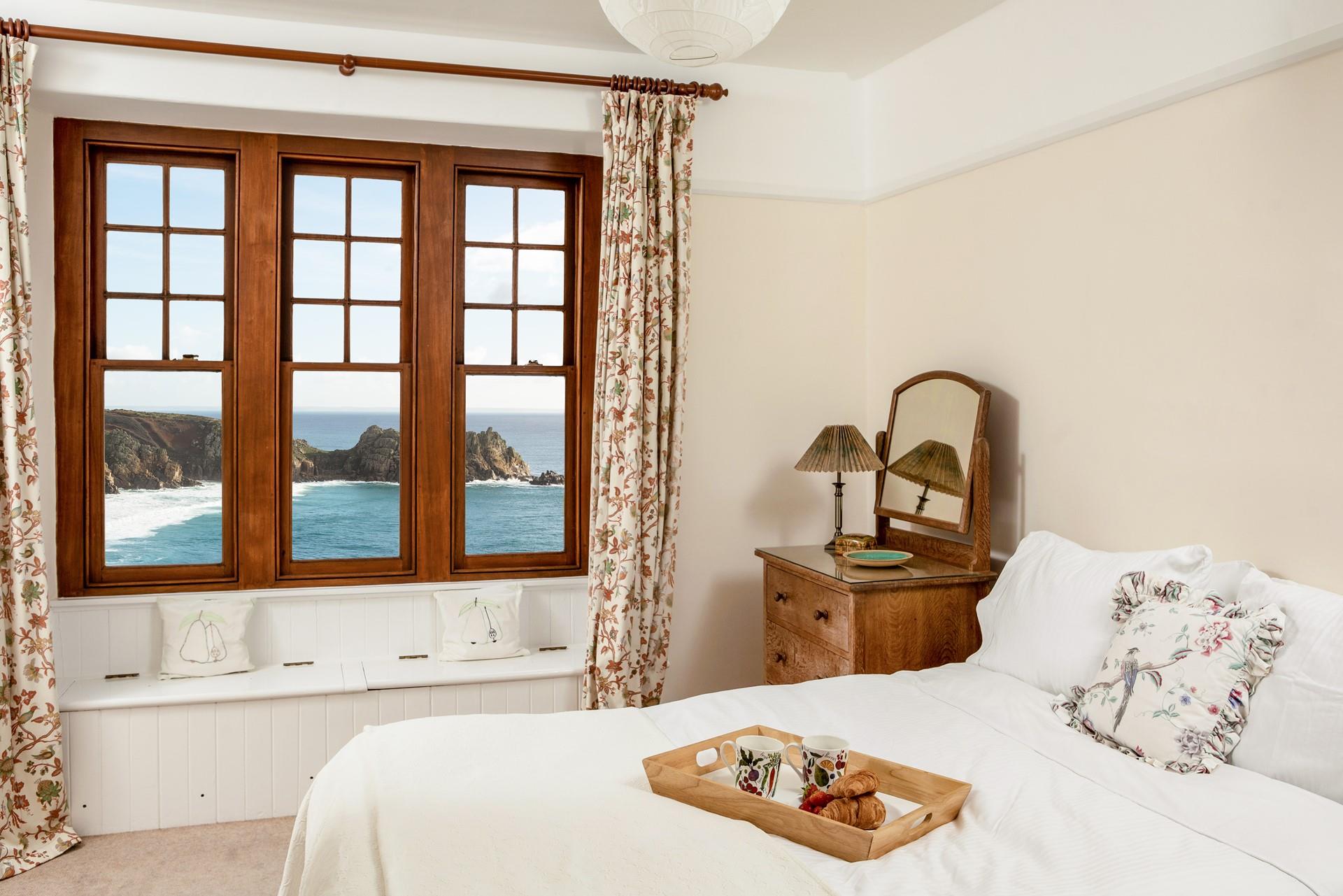 Indulge in warm pastries for breakfast as you gaze across the ocean.