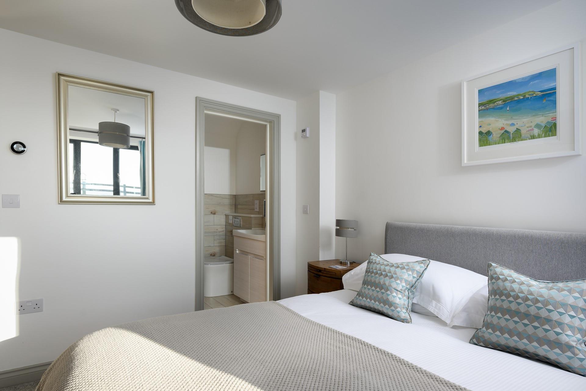 Calming neutrals create a relaxing space with a sumptuous king size bed.