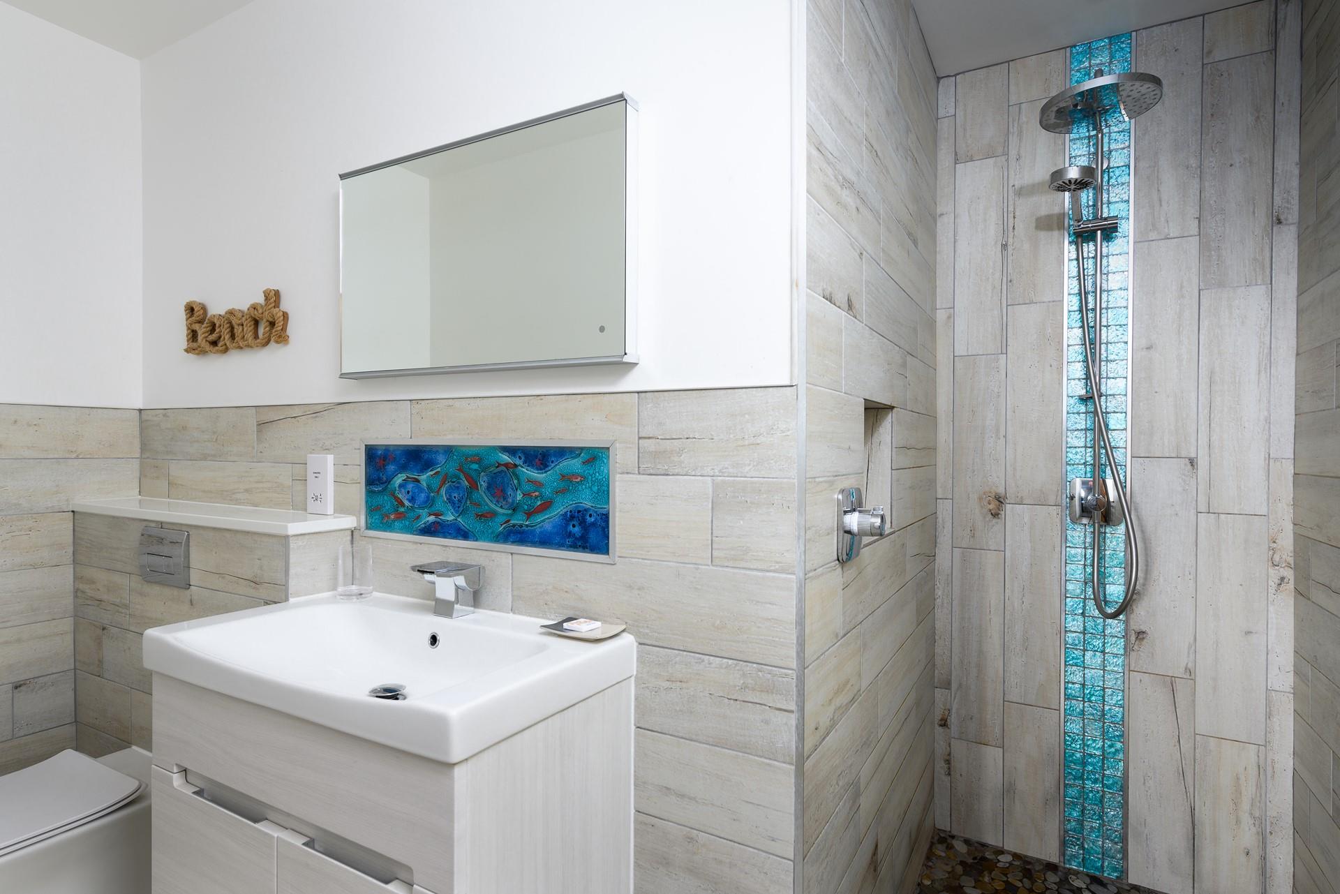 Wash off sandy toes in the luxurious walk-in rainfall shower.