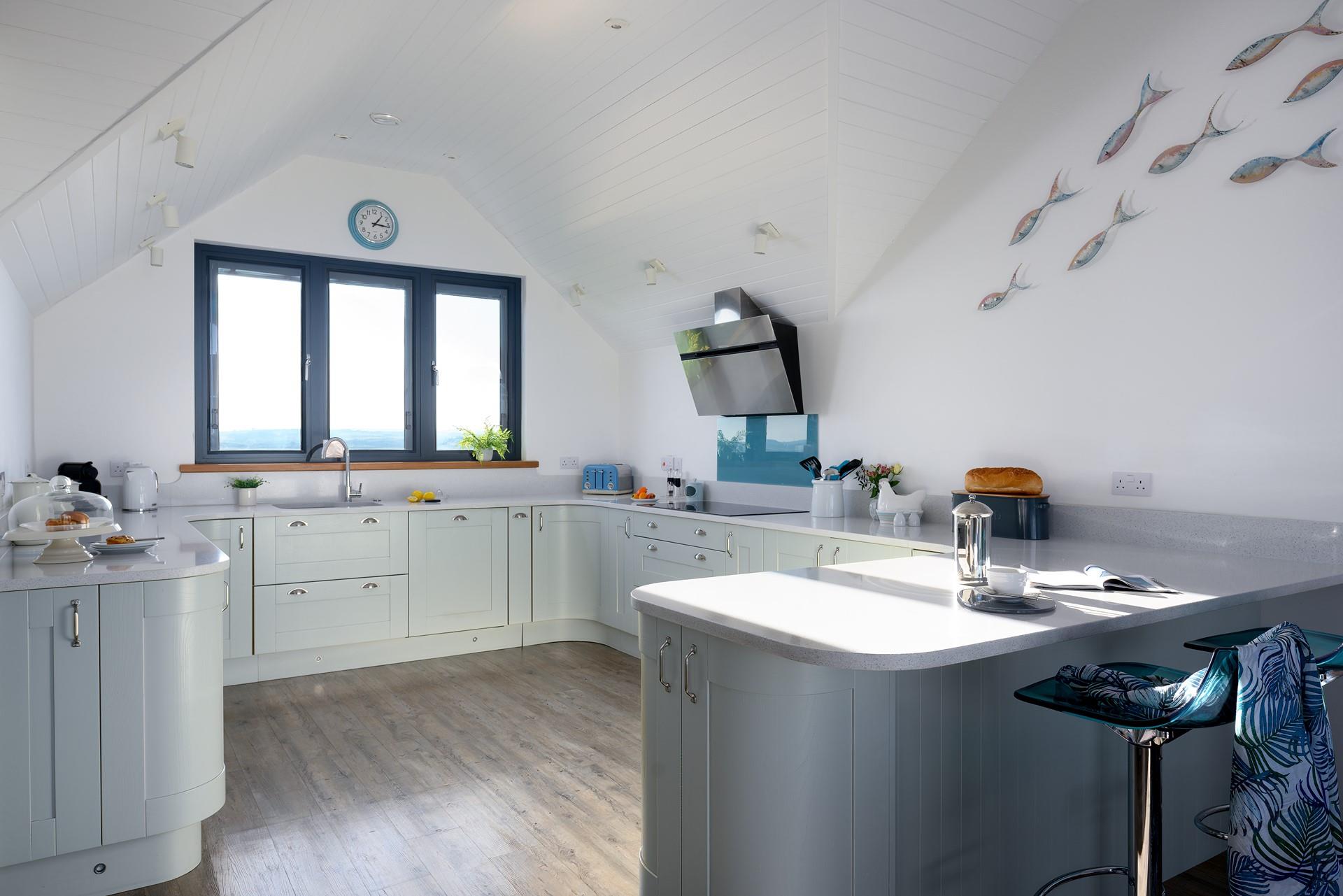 Stunning local art from Jo Downs adorns the kitchen wall beautifully.