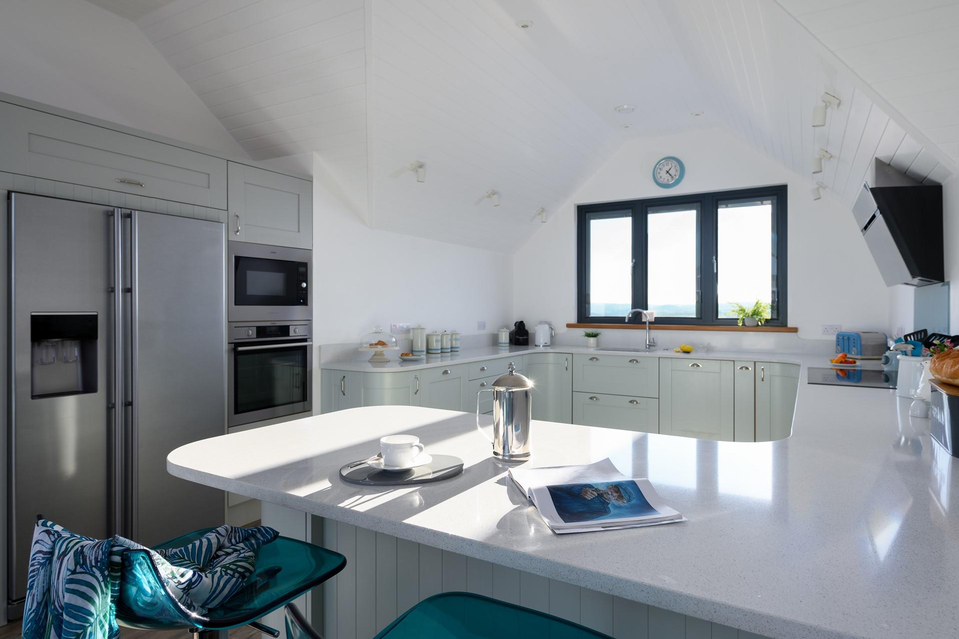 The kitchen is modern and light, perfect for cooking up a storm.
