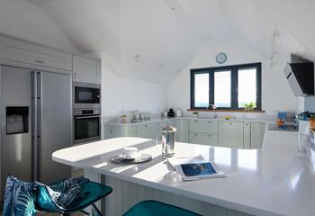 The kitchen is modern and light, perfect for cooking up a storm.