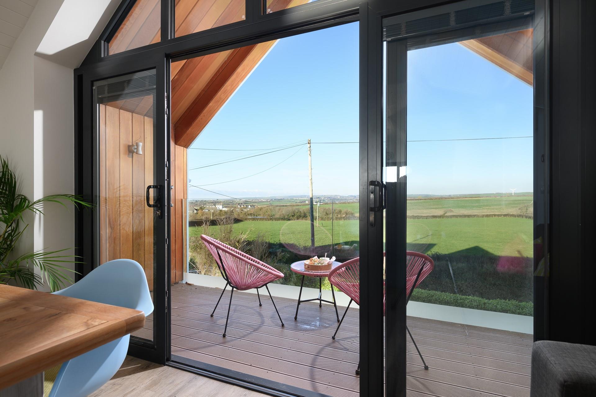 The balcony is the perfect place for alfresco dining with a view.