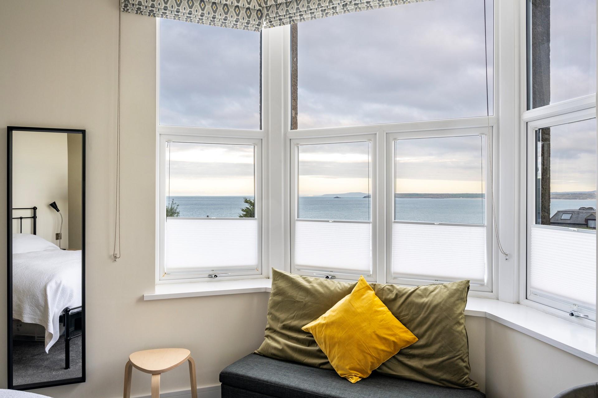 Open the blinds to watch the sunrise over the Bay.