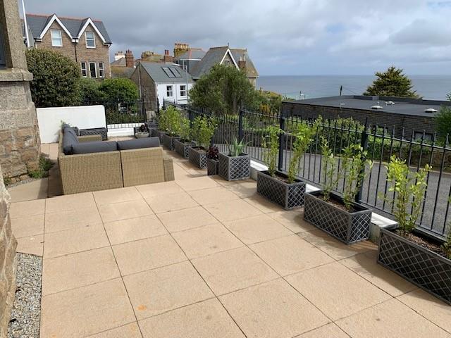 The front terrace takes advantage of the views across the Bay.