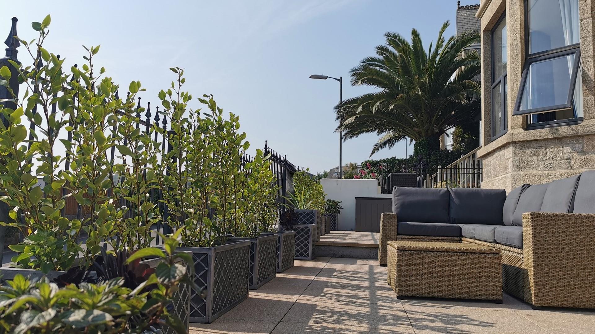 The outside furniture is perfect for relaxing in the late afternoon sun.