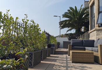 The outside furniture is perfect for relaxing in the late afternoon sun.