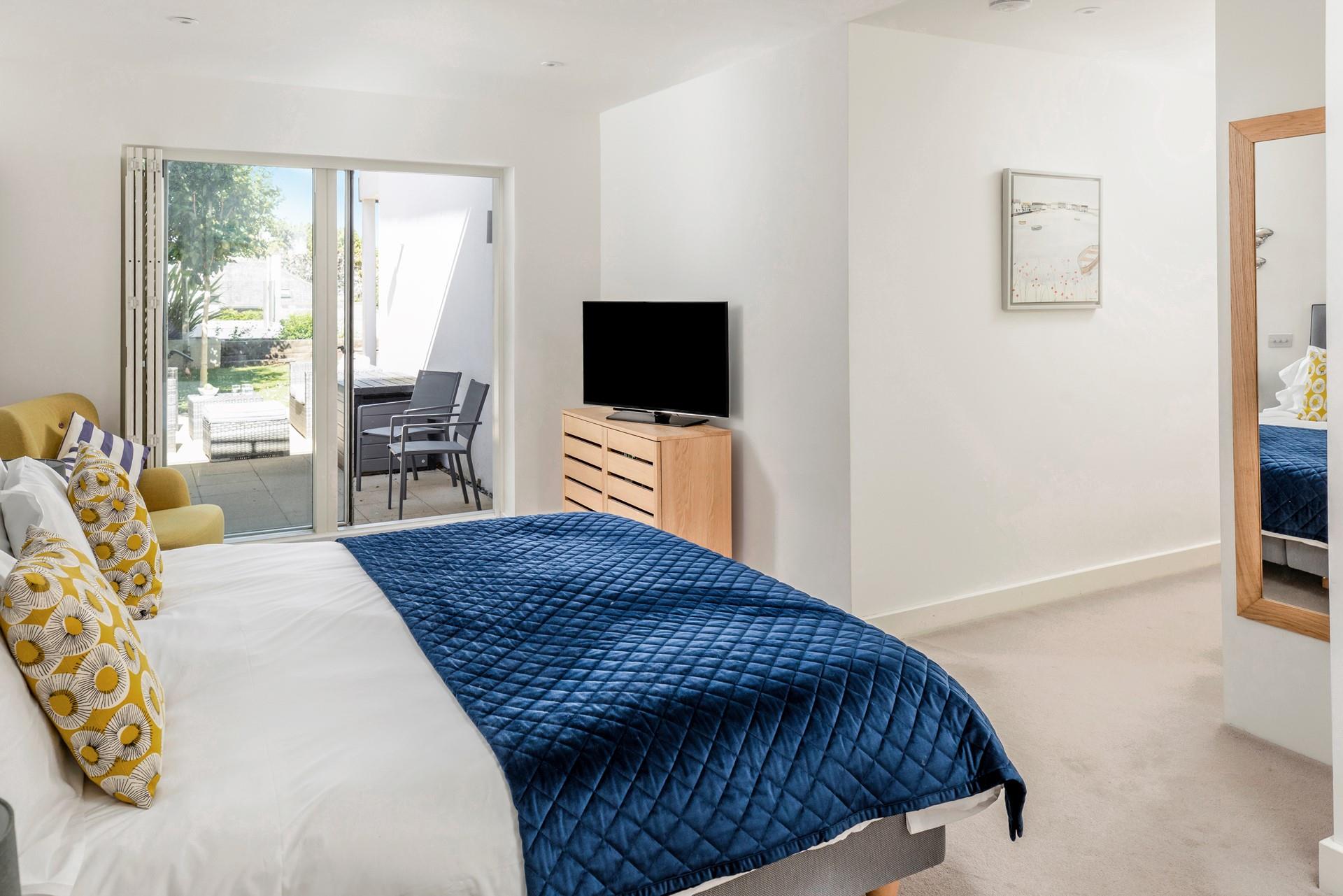 The spacious bedroom is the perfect base to return each evening.