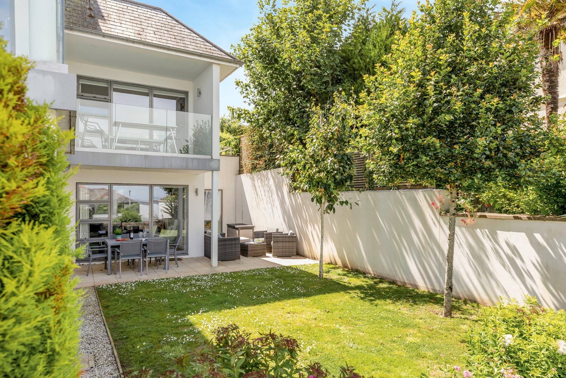 The outside area has lovely rattan furniture perfect for al fresco dining.