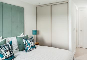 Bedroom 1 has plenty of storage for keeping your holiday best neat and tidy. 