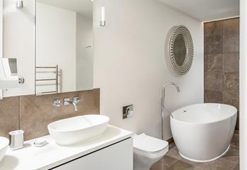 A palatial, master en suite is truly luxurious, inviting you to take a long relaxing soak in the free standing bath.
