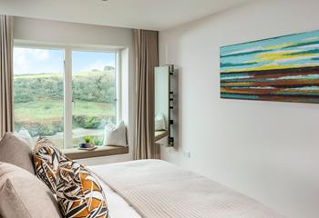 Bedroom 2 offers zip and link beds and yet more stunning views. 