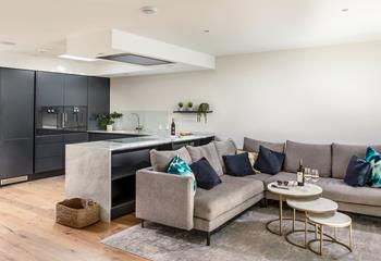 Cosy up on the sofa and wait for dinner to be served, with the sociable living area creating a great place to relax.
