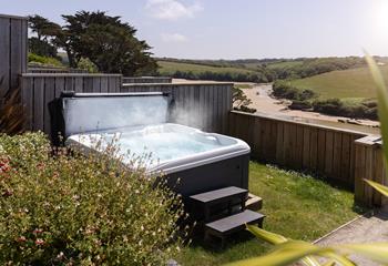 The hot tub is the perfect addition for taking a dip at any time of the day.