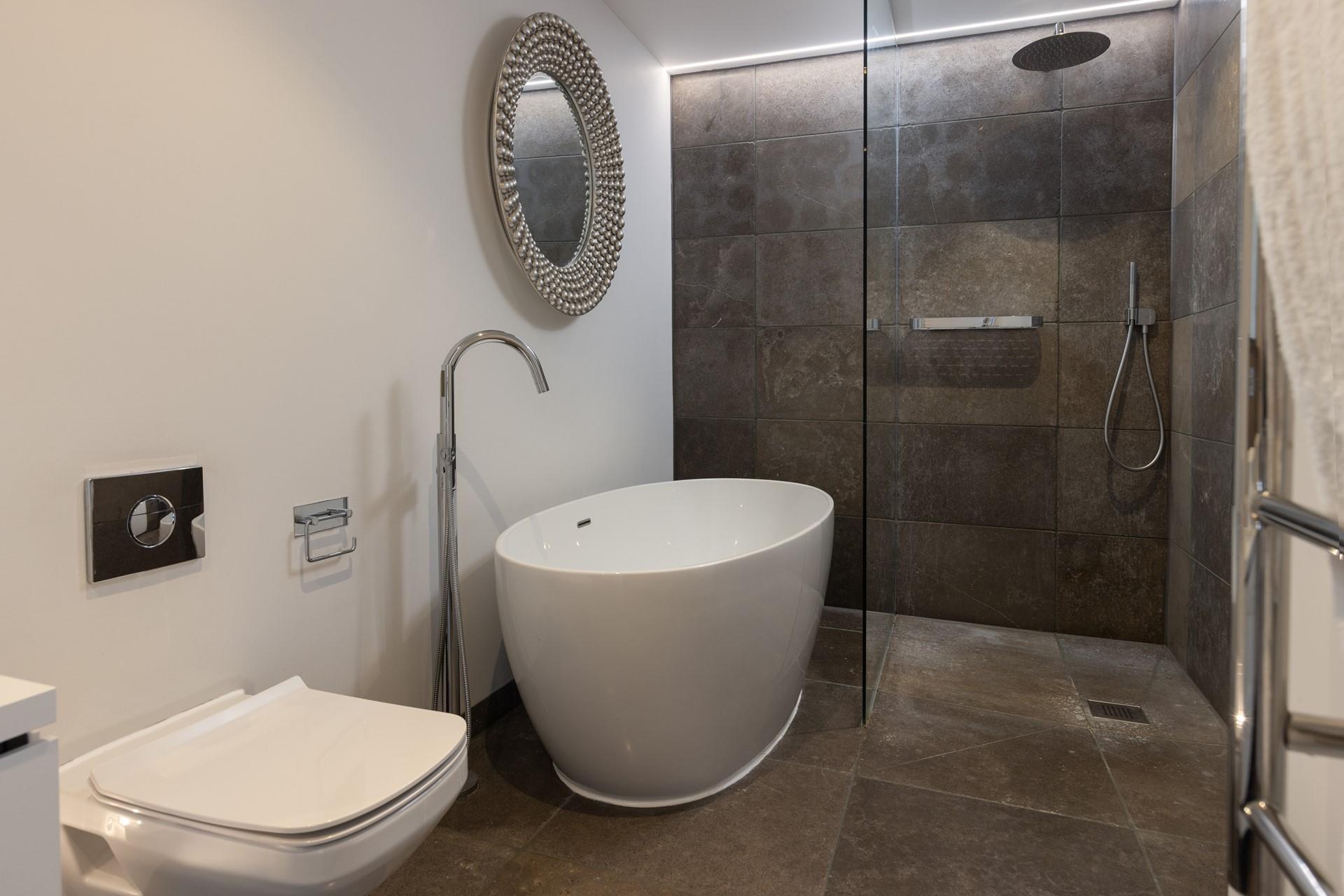 The master en suite is truly luxurious, inviting you to take a long relaxing soak in the free standing bath.