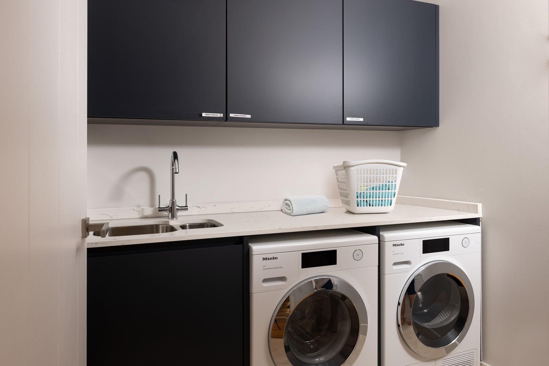 A utility room on the ground floor has all the essentials for a busy family holiday. 