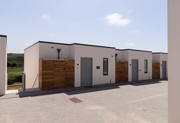 From the car port, you're a few steps from the entrance at 8 Woodlands.