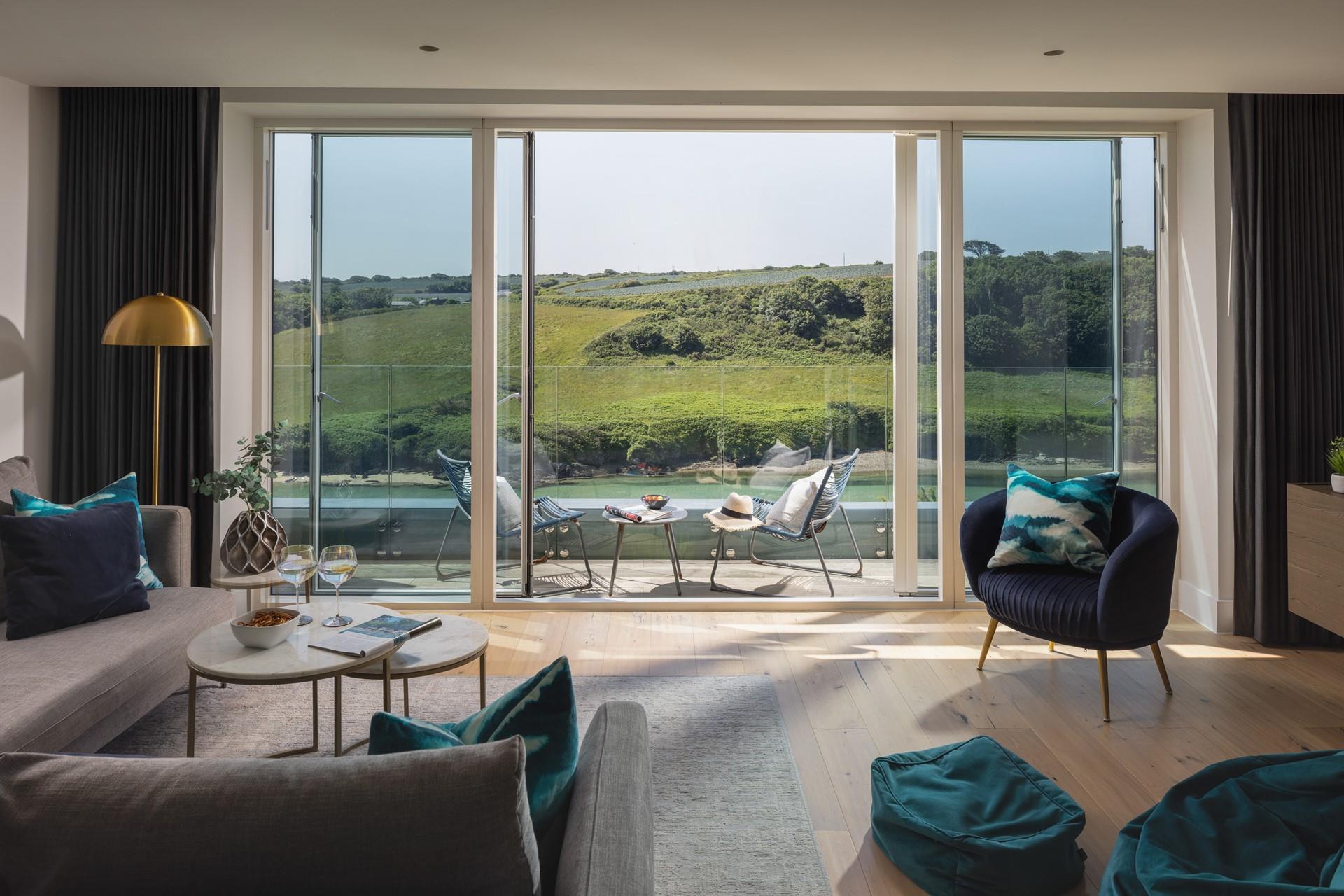 Sit back, relax, and watch the tide ebb and flow from the stunning living space.