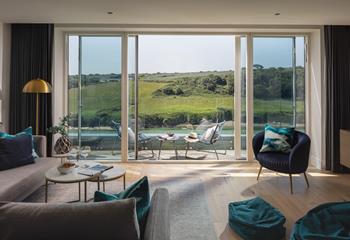 Sit back, relax, and watch the tide ebb and flow from the stunning living space.
