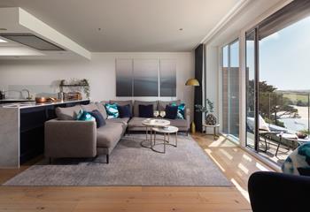 The open plan living area is a beautiful space for relaxing by the sea.