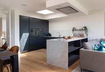 The high end kitchen is fitted with all the mod cons you need!