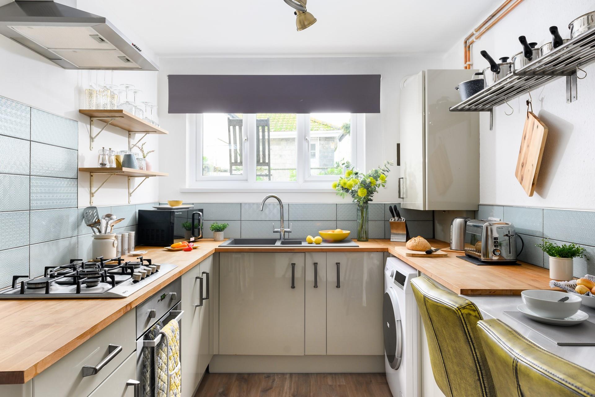 The kitchen is modern and well-equipped for cooking a delicious meal.
