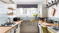 The kitchen is modern and well-equipped for cooking a delicious meal.