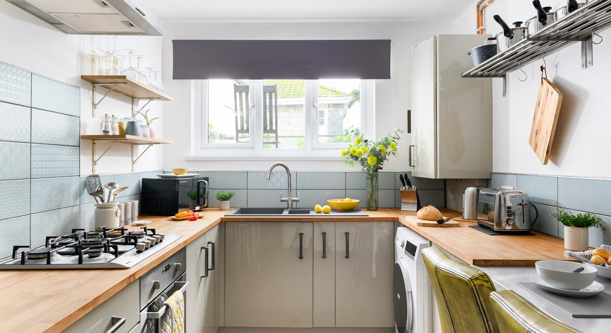 The kitchen is modern and well-equipped for cooking a delicious meal.