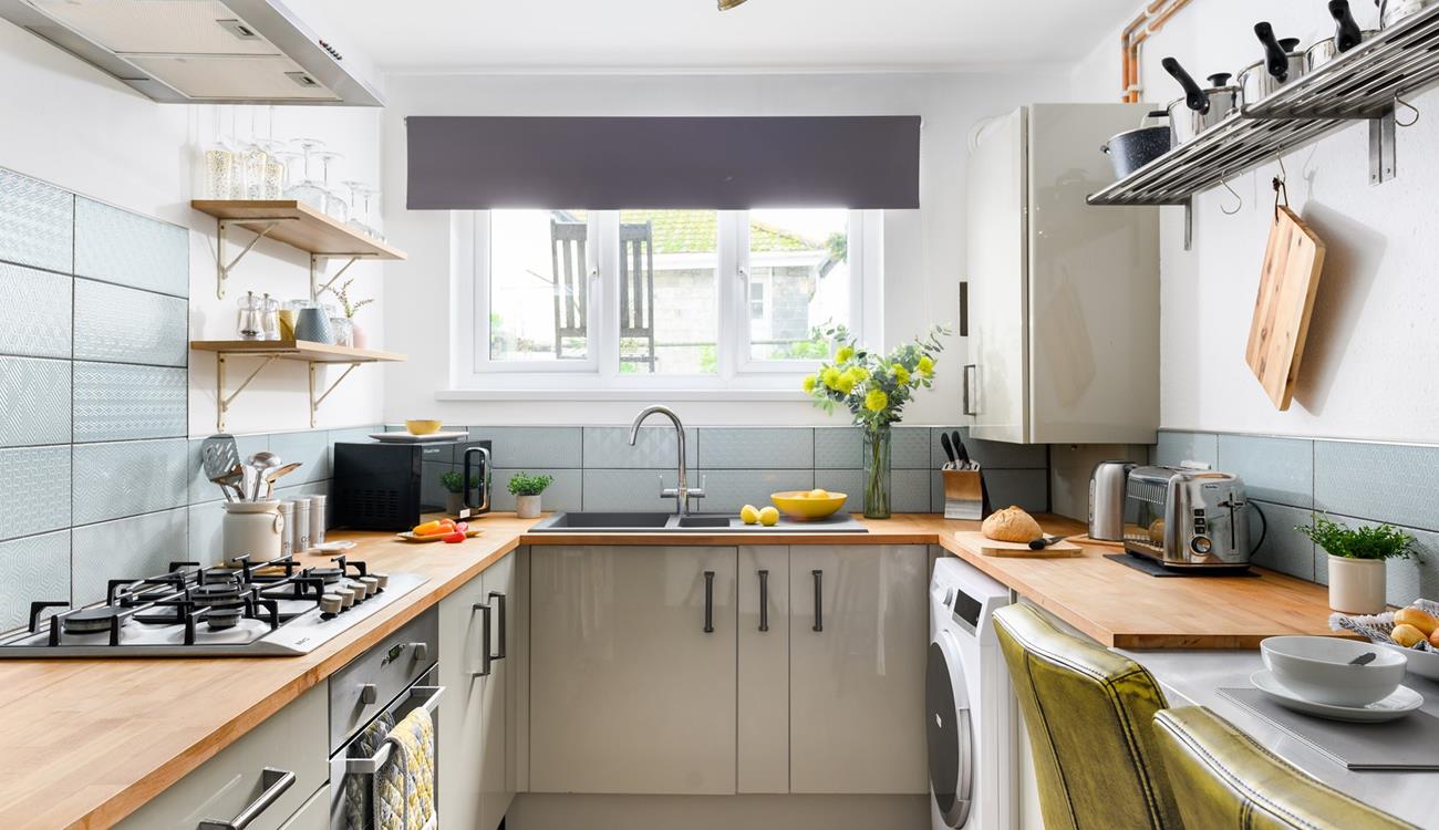 The kitchen is modern and well-equipped for cooking a delicious meal.