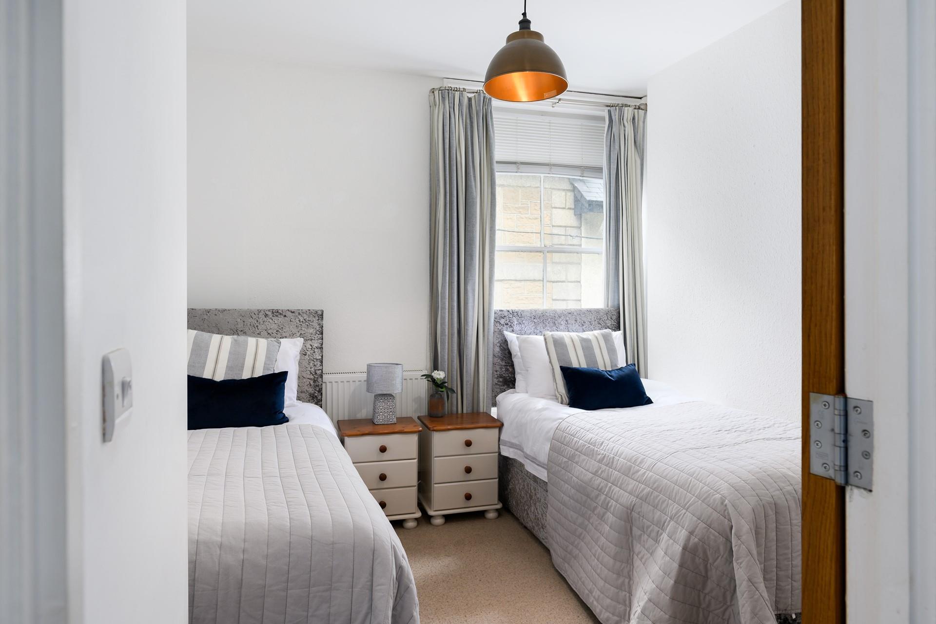 Wake up and climb out of bed to check the weather and choose a beach to go to.