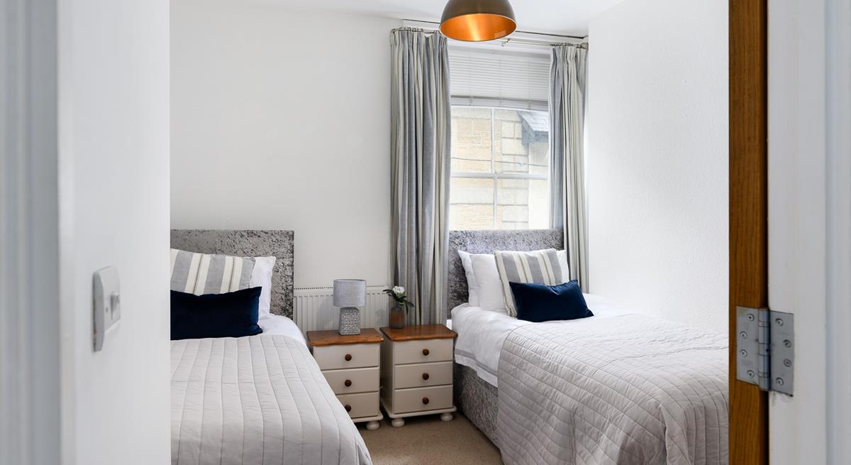 Wake up and climb out of bed to check the weather and choose a beach to go to.