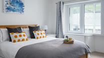 The simple yet stylish decor makes bedroom 2 a calming space to drift off.