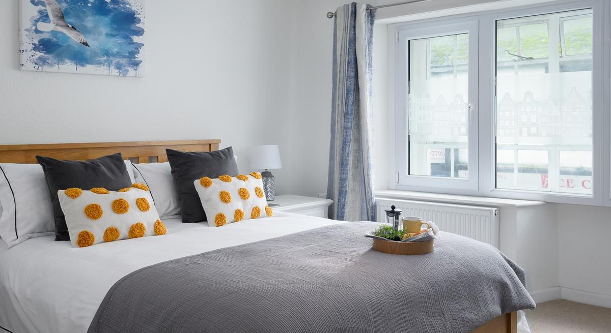 The simple yet stylish decor makes bedroom 2 a calming space to drift off.