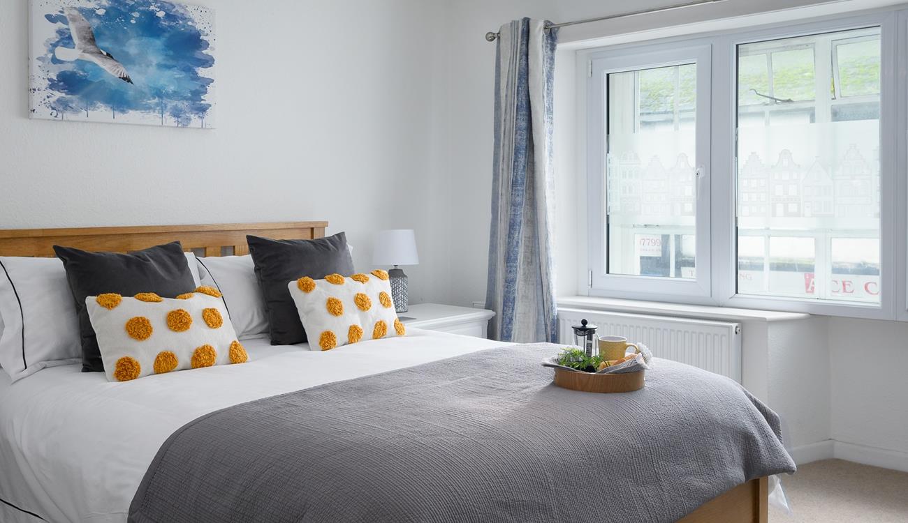 The simple yet stylish decor makes bedroom 2 a calming space to drift off.