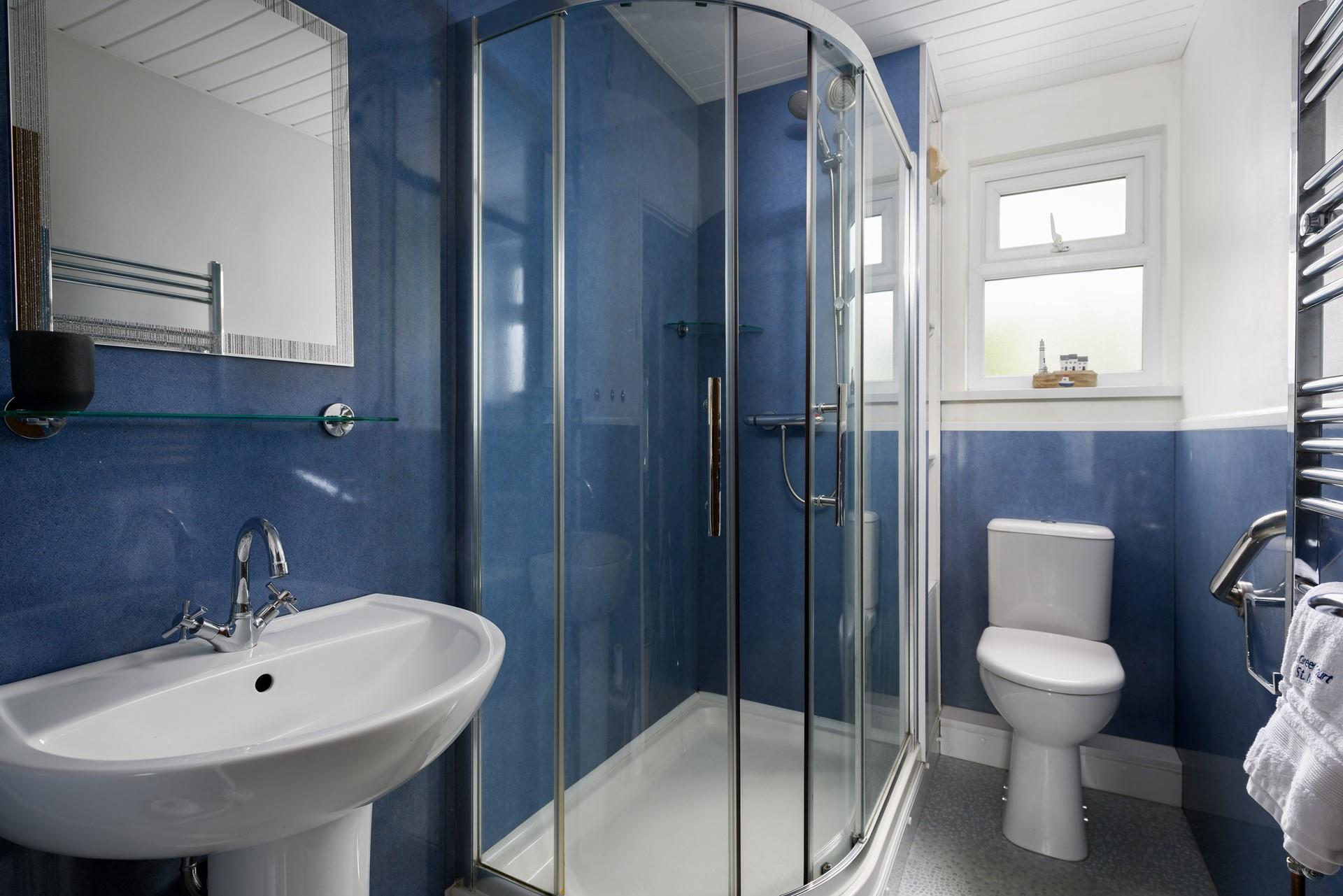 Wash off sandy toes in the shower after a day on Porthmeor beach.