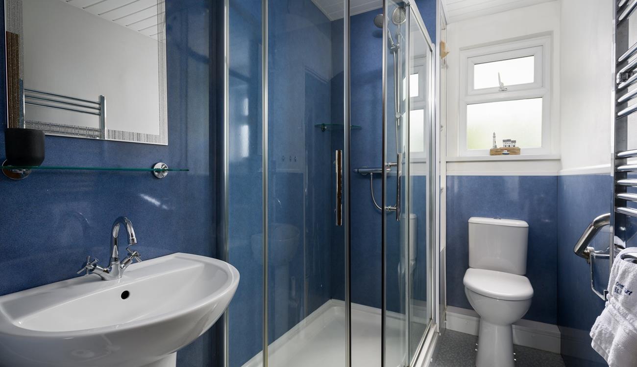 Wash off sandy toes in the shower after a day on Porthmeor beach.