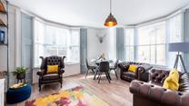 Bright and colourful, the sitting room is the perfect base to come back to after beach days.